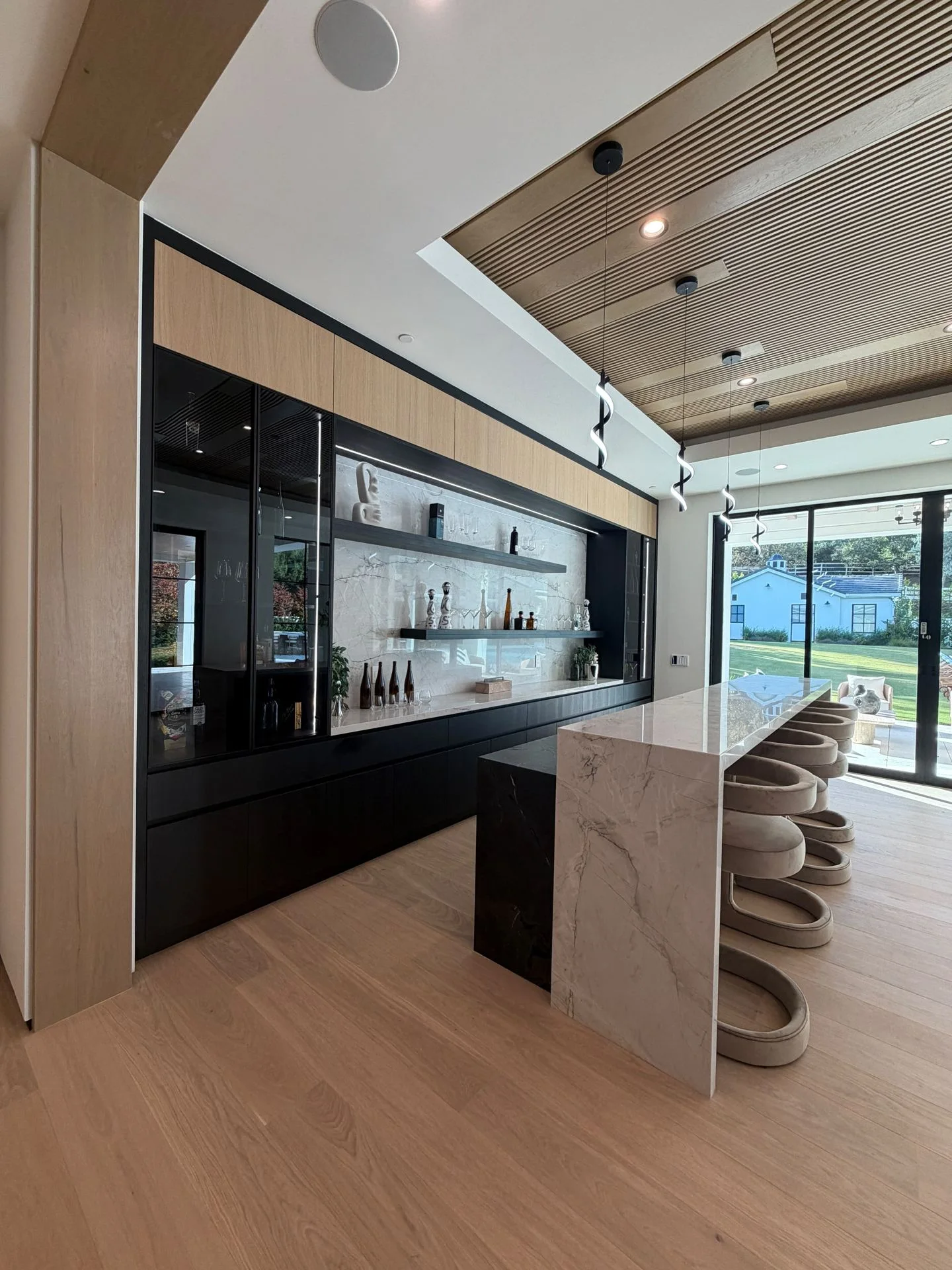 Wine display and bar with wood-toned plank flooring