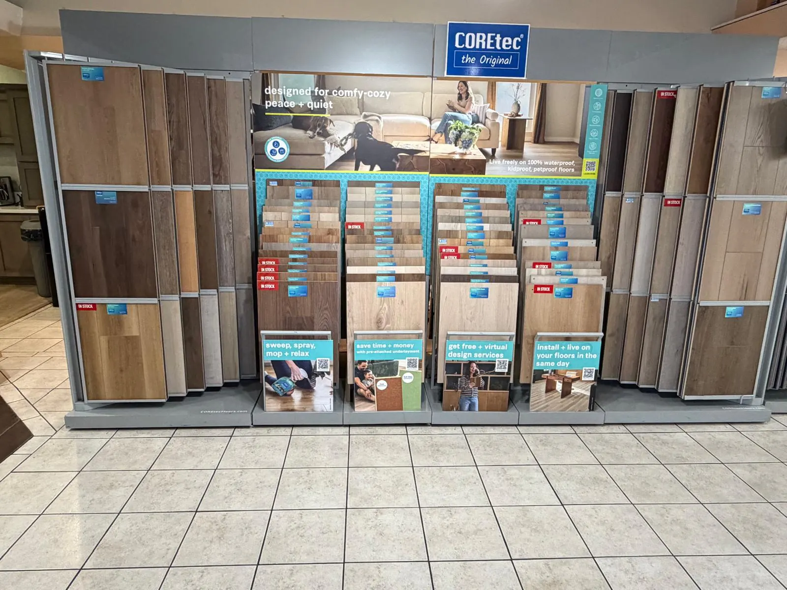 Wood-look flooring display boards and sample racks in the Velmont mobile flooring showroom
